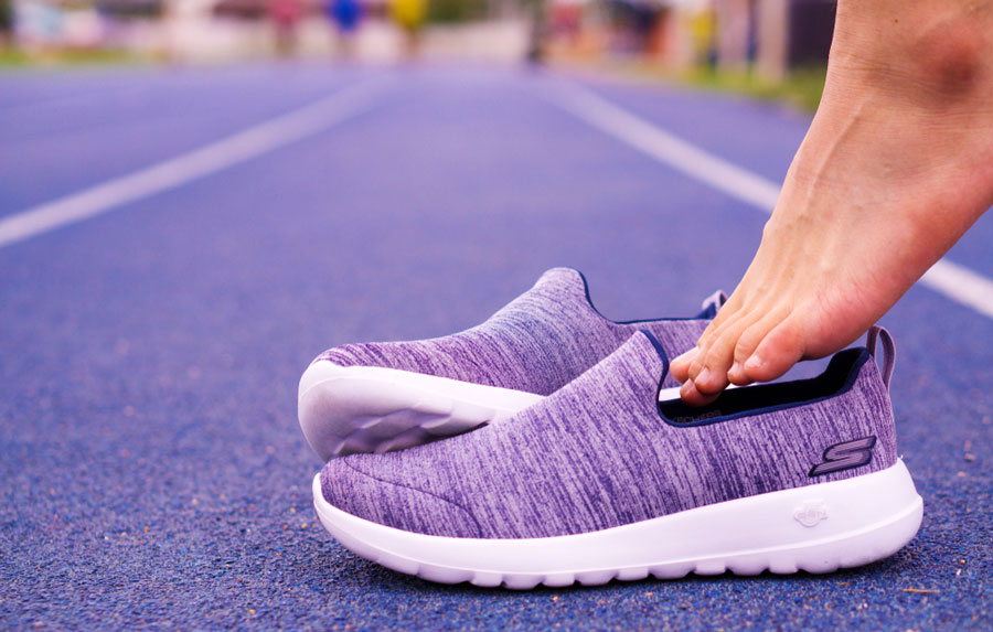 A Skechers Slip-On shoes being worn by a man