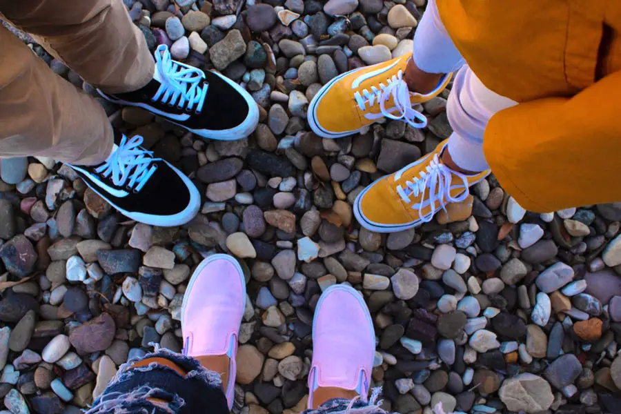 Siblings wearing different kinds of Vans shoes
